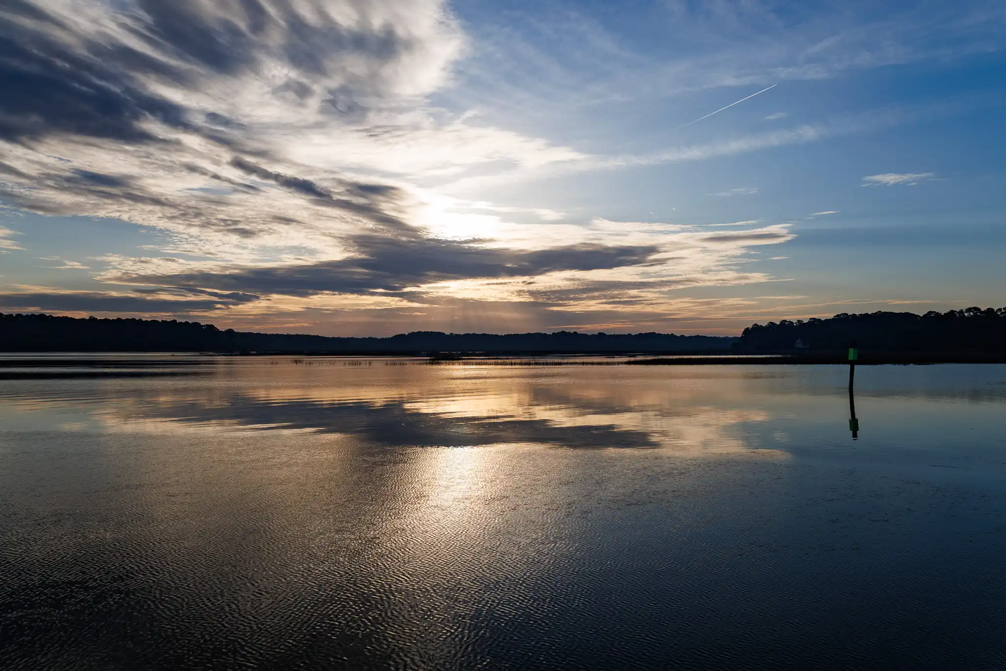 Golden clouds reflected on the water at our anchorage.