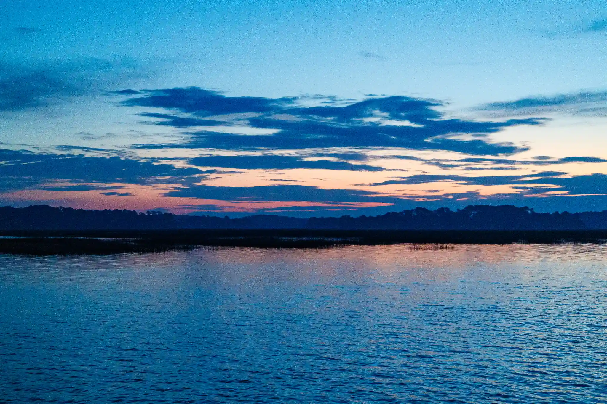 Beautiful blues, and pinks decorate the water over Beafort, SC.