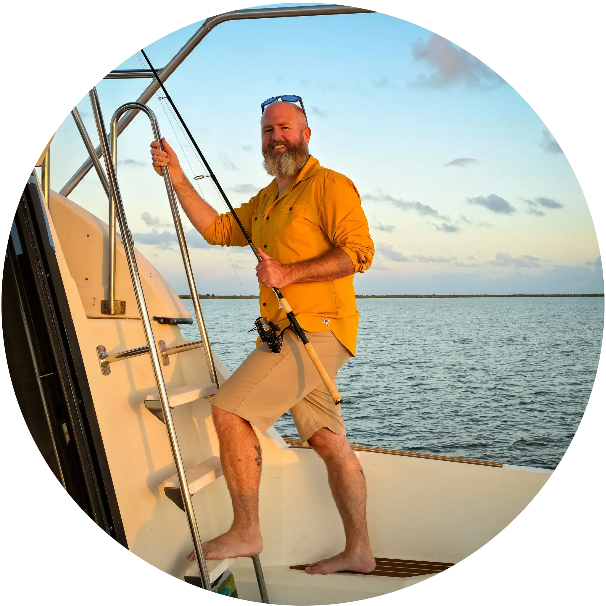 Tom on M/Y Swamp Puppy, climbing to the topside with a fishing rod.