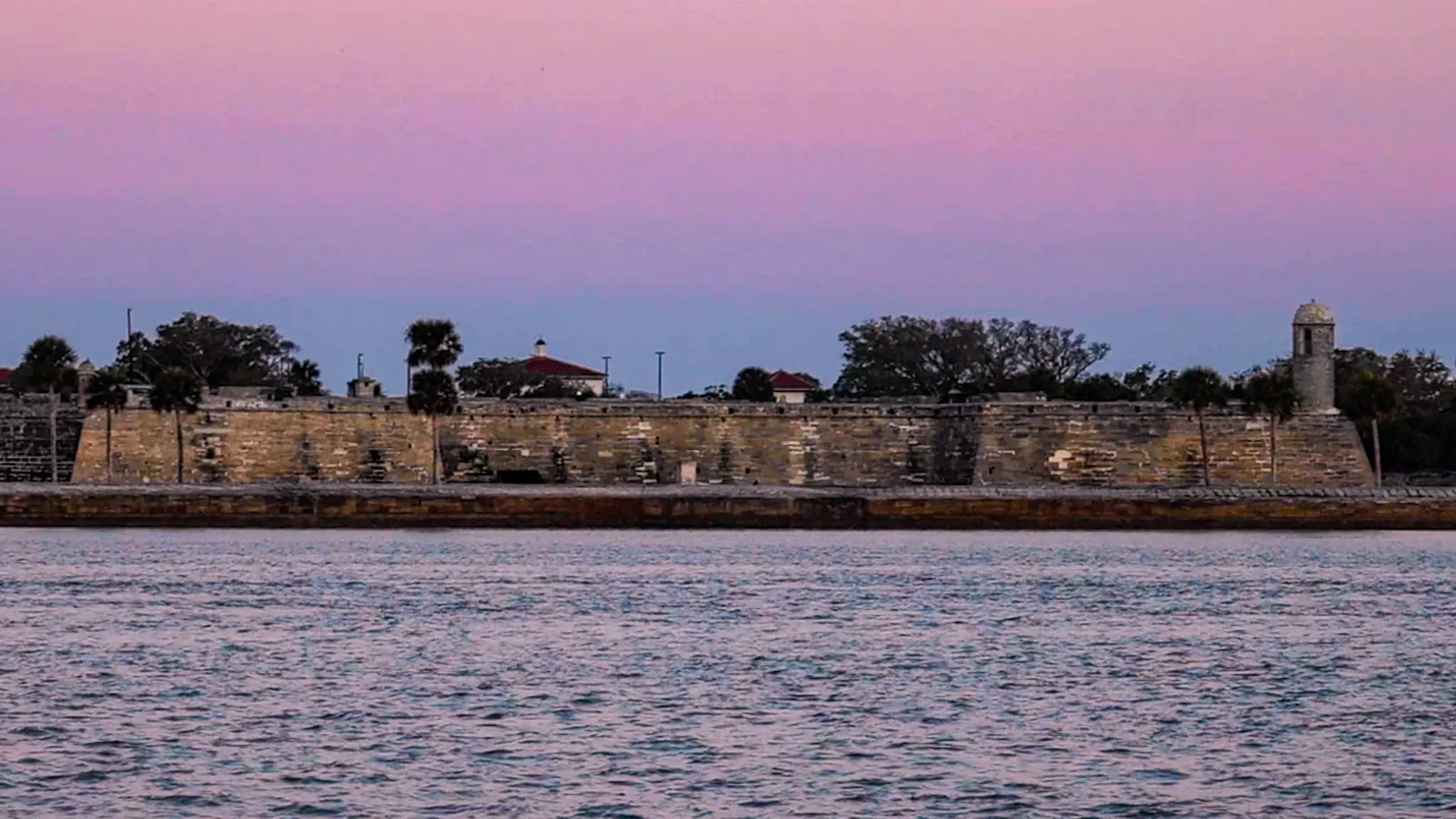 A pastel sunrise behind the Castillo de San Marcos National Monument in St. Auggustine, Florida.