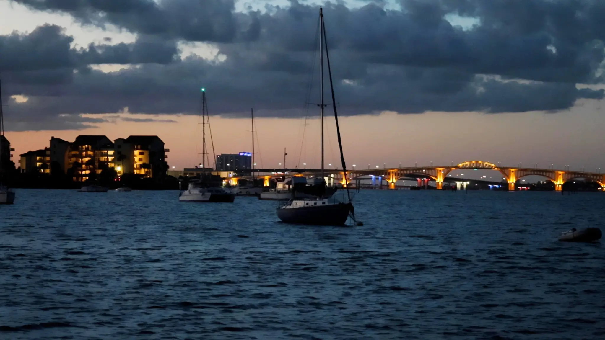 View from our anchorage of the Daytona Beach Memorial Bridge lit up at night.