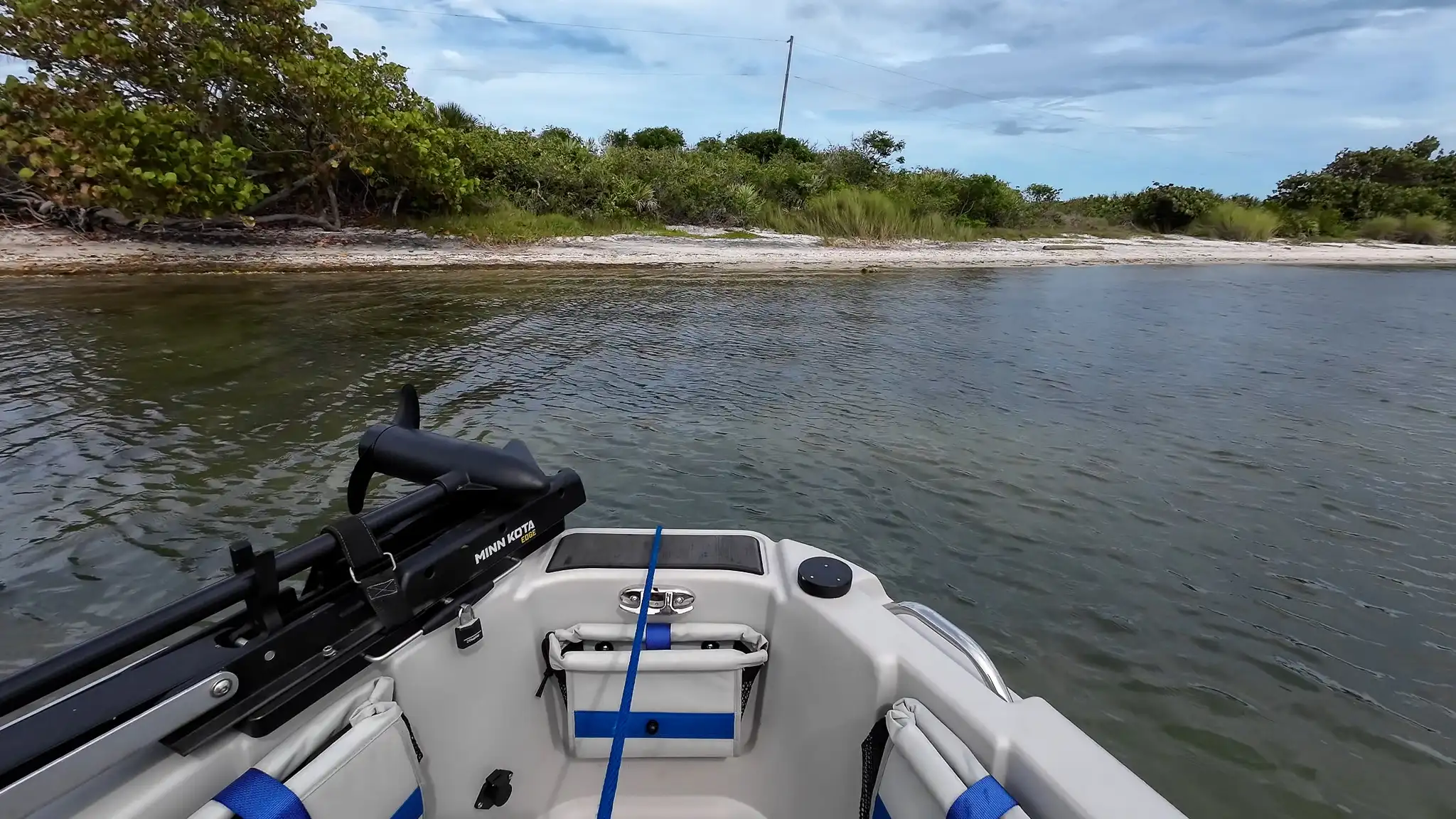 Dinghy-ing to the shore at our Sebastian Inlet anchorage.