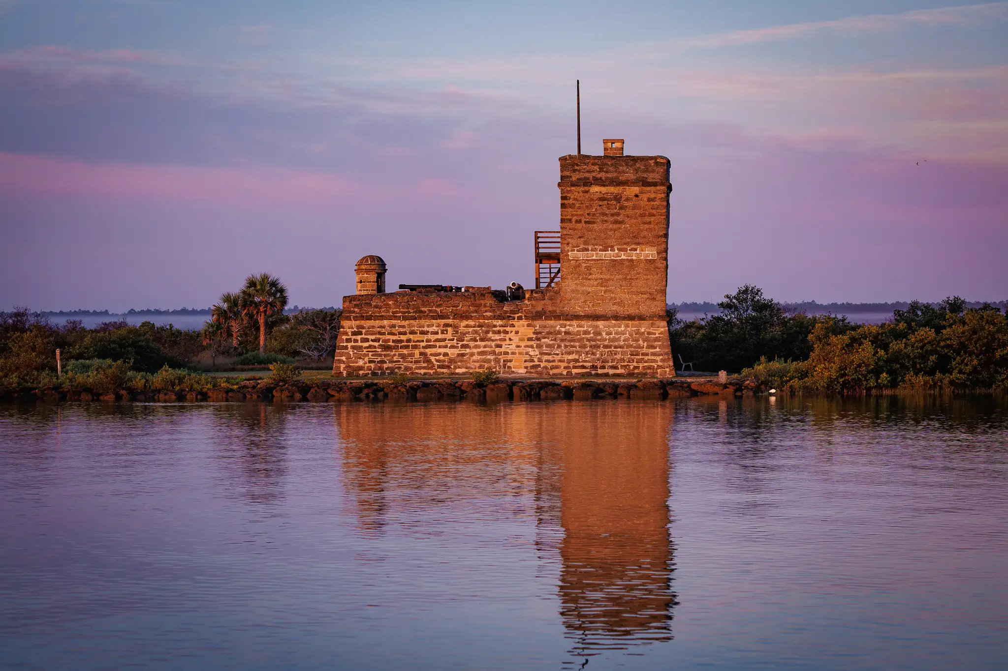 Fort Matanzas National Monument in a beautiful lavendar and hot pink sunset.