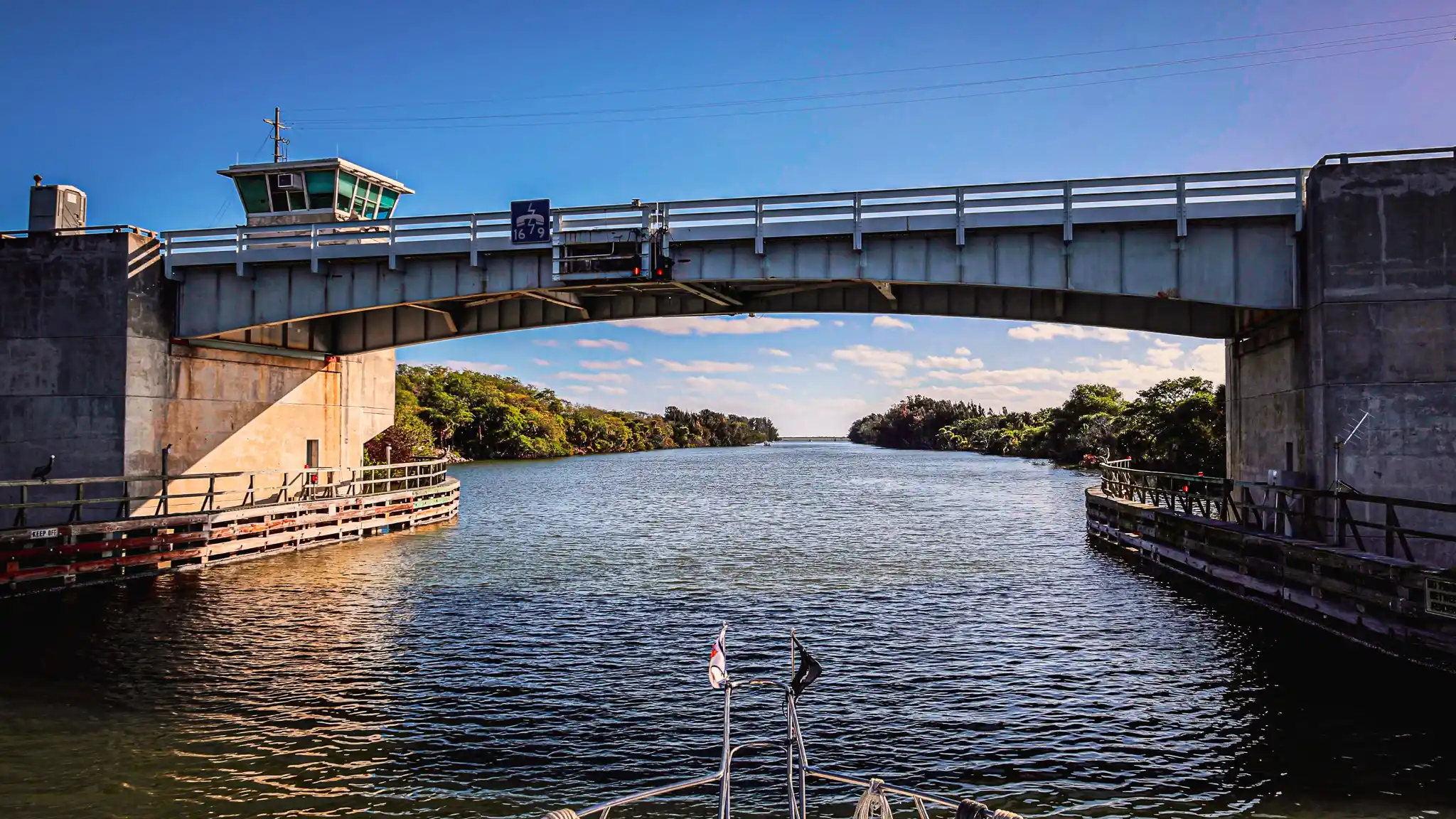 Our bow poised to pass underneath the Haulover canal bridge.