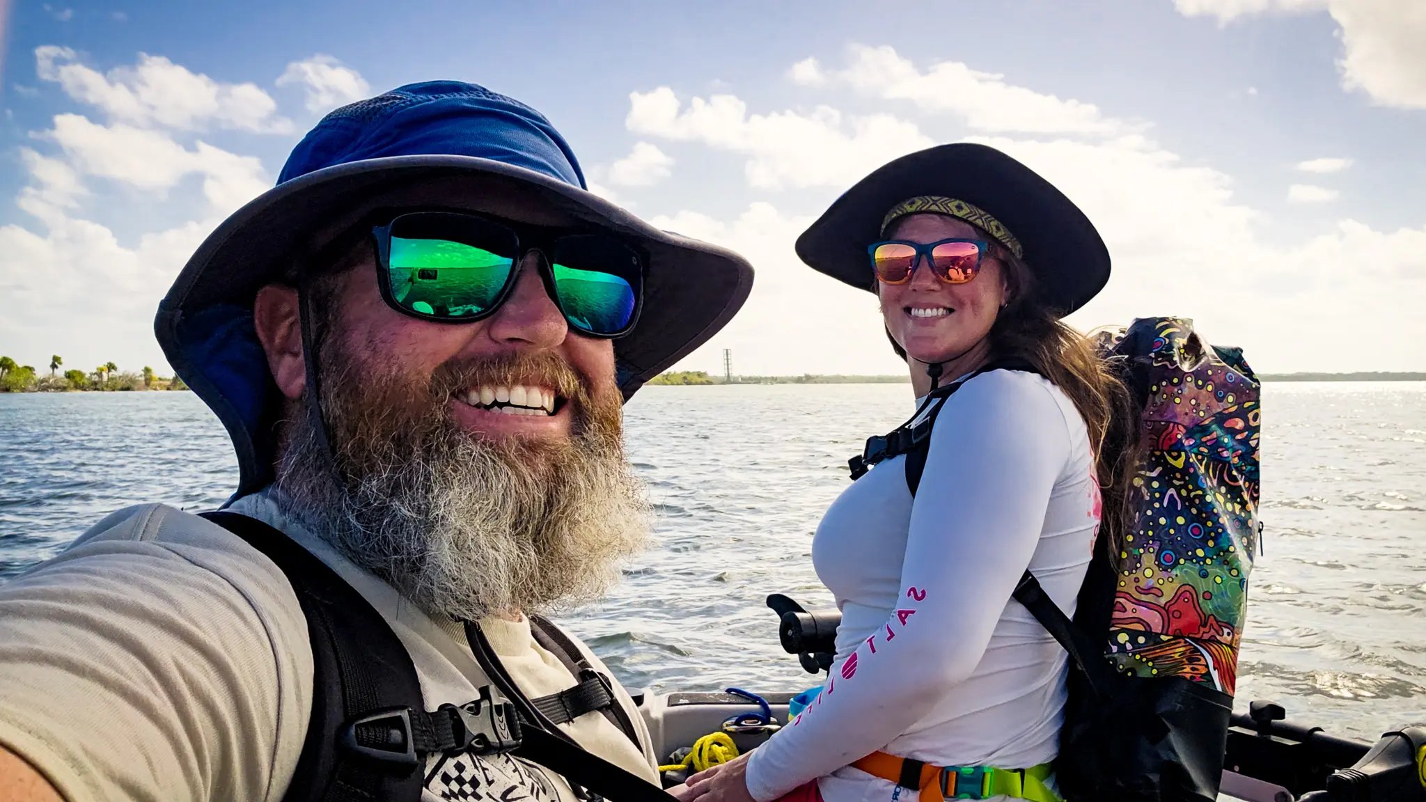 Tom and Elyse on their dinghy, having fun around their NASA anchorage.
