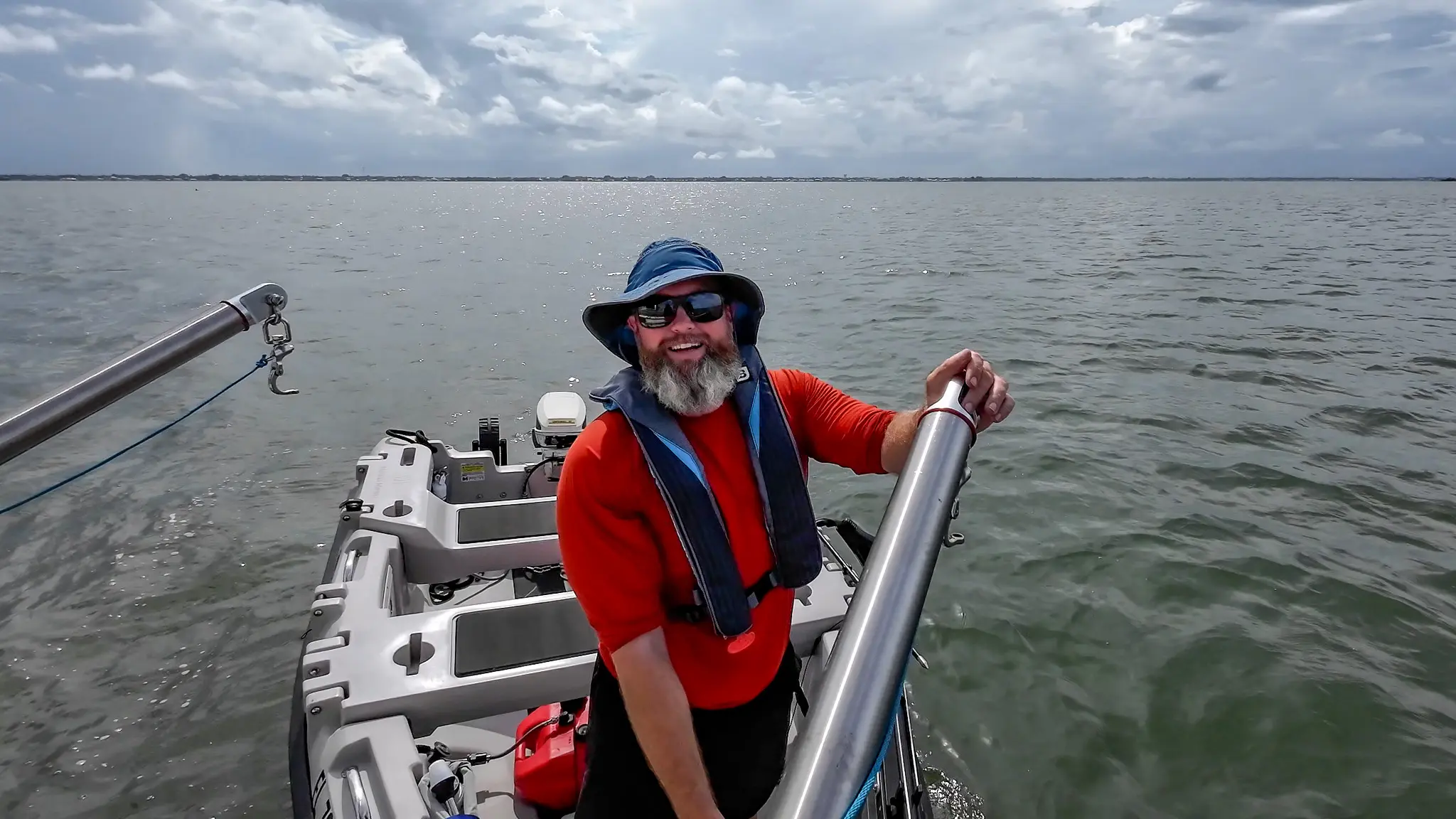 Tom standing at our dinghy davit, deploying our Mantus dinghy.