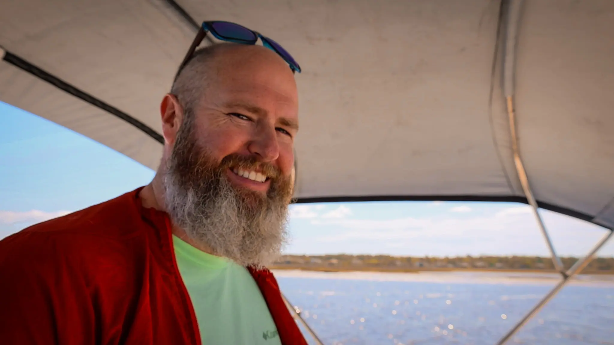 Captain Tom smiling as he drives our Loop boat.