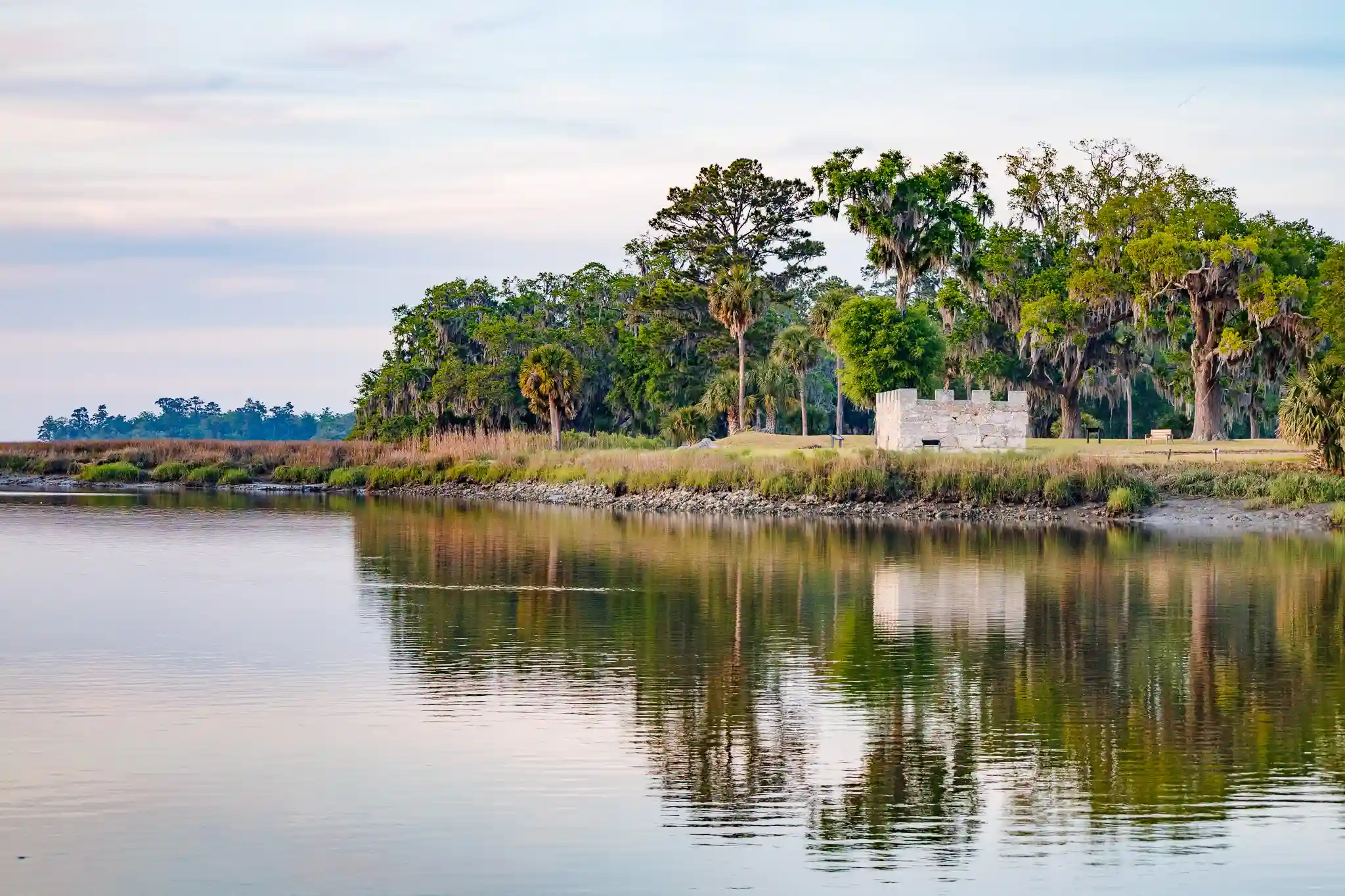 Fort Frederica positioned at the edge of St. Simons Island, reflected perfectly in the still water.