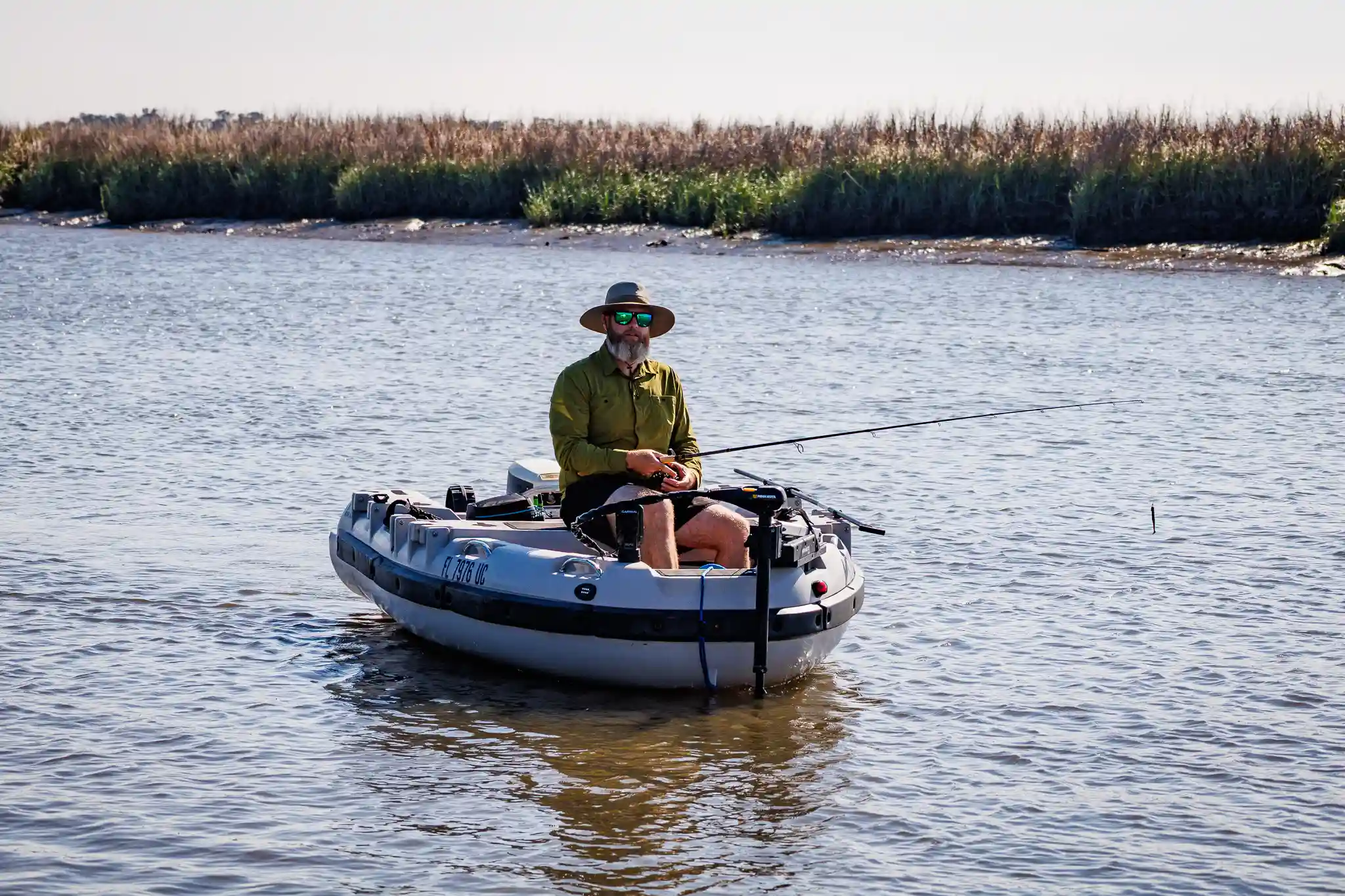 Tom fishing from our Mantus dinghy on the Great Loop.