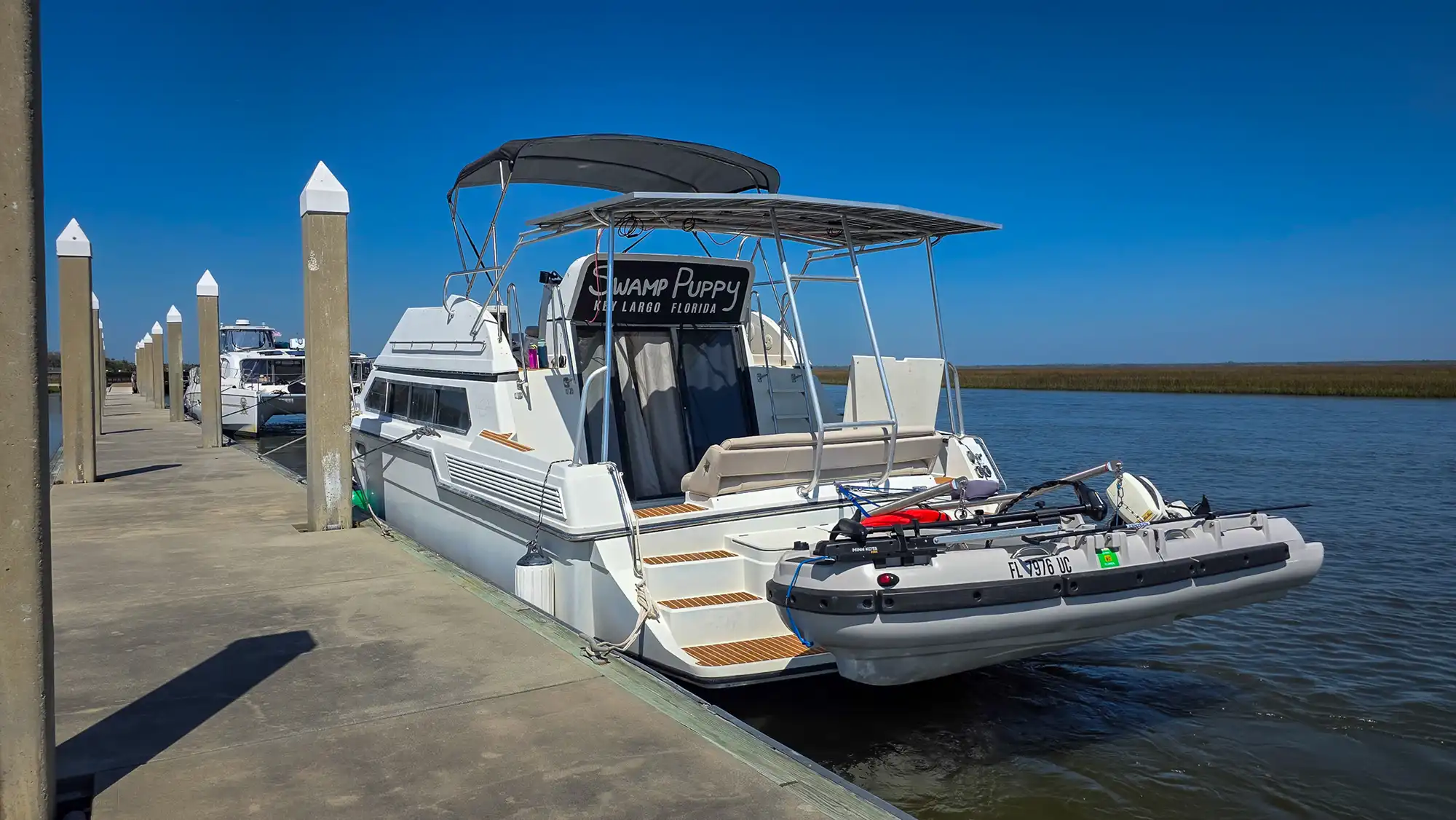 Our Loop boat, Swamp Puppy, tied to a dock.