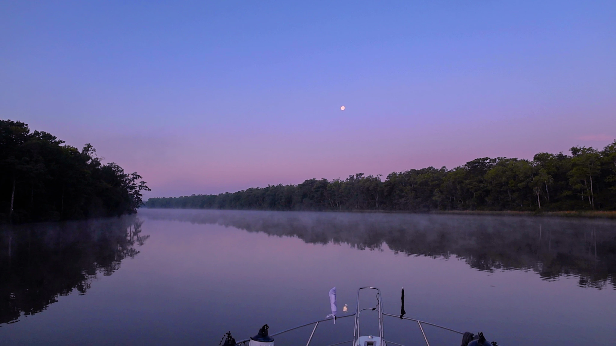 The pulpit of our Loop boat against a beautiful purple first light morning sky.