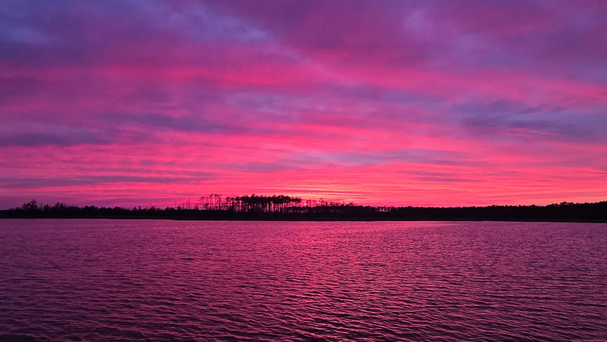 Goose Creek Anchorage Review | A hot pink sunset over Goose Creek.