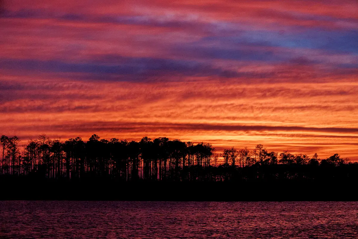 An epic hot pink sunset over Goose Creek anchorage.