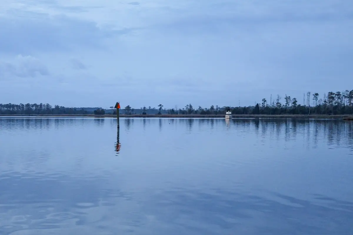 The mirror-like waters at Goose Creek, with another boat anchored across the creek.